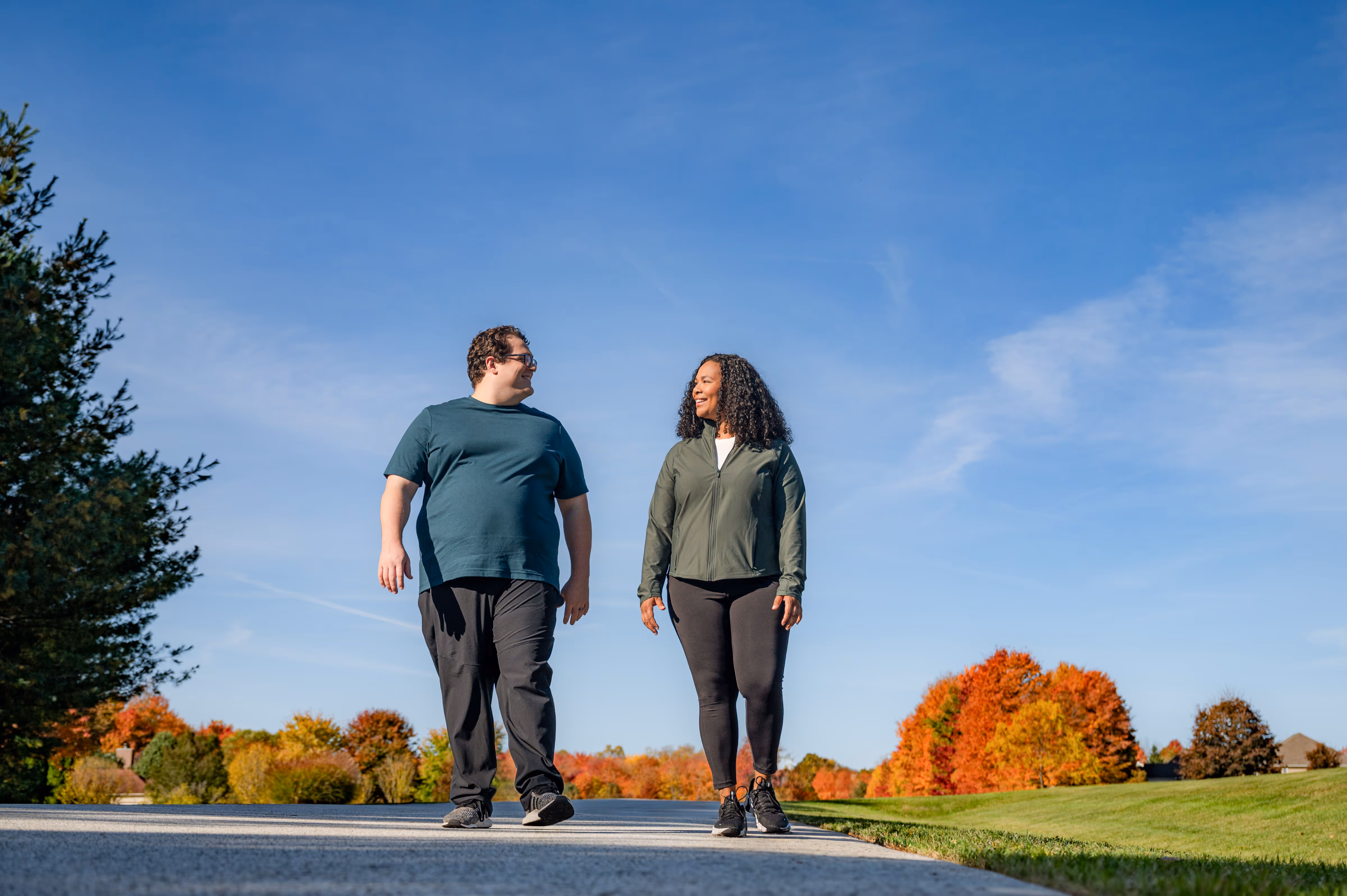 Man and woman walking outside