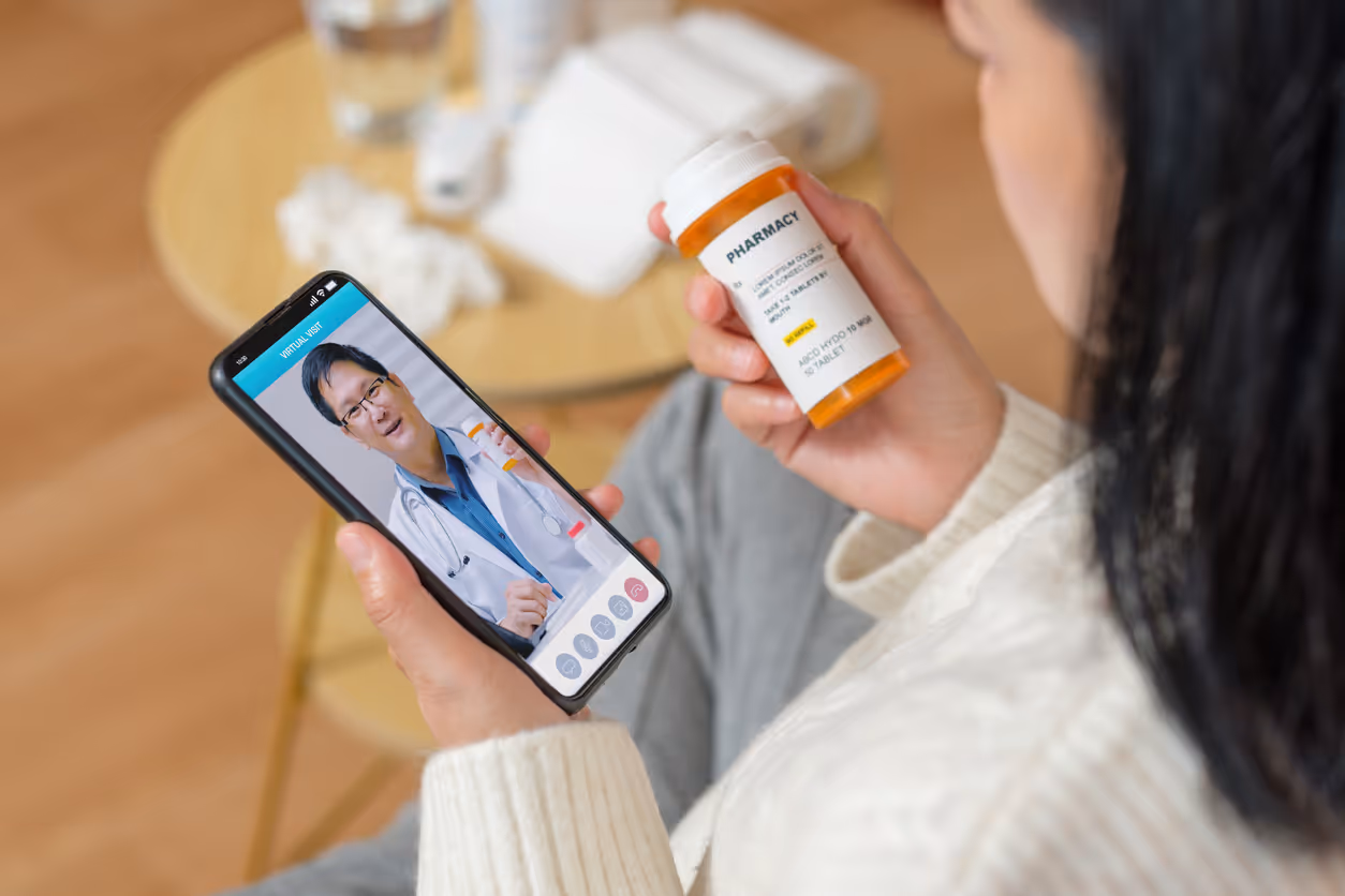 Virtual doctor visit and patient holding medication