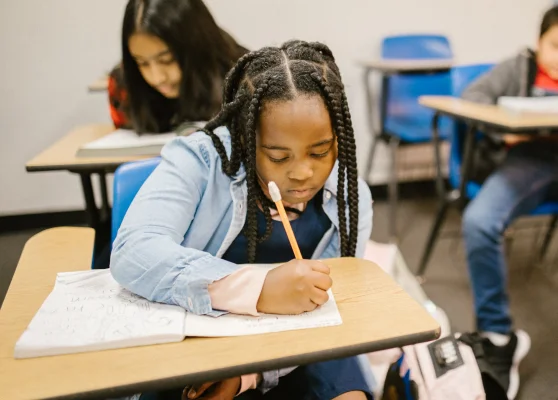 Young girl busy in class