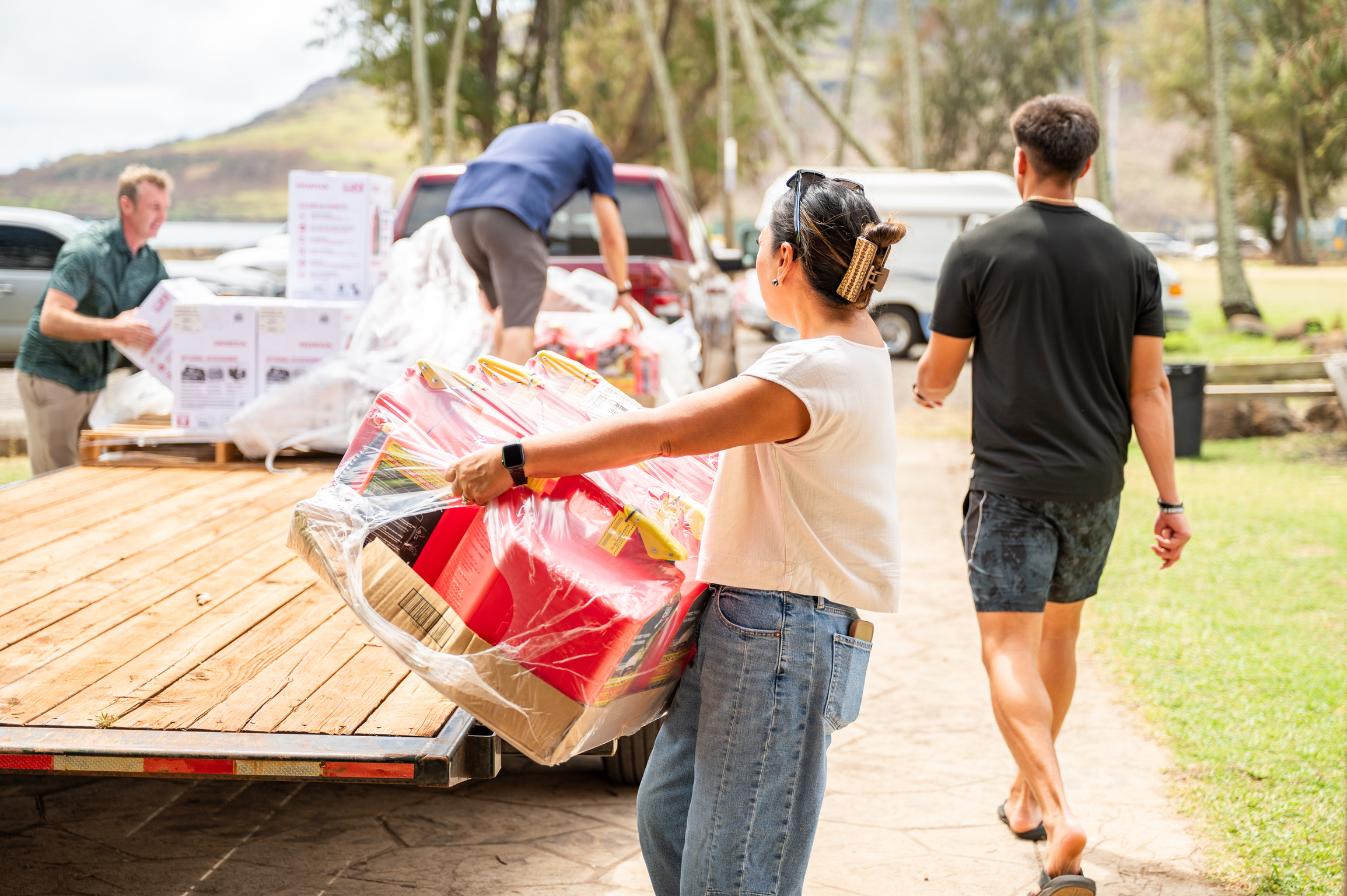 Volunteers carrying relief supplies