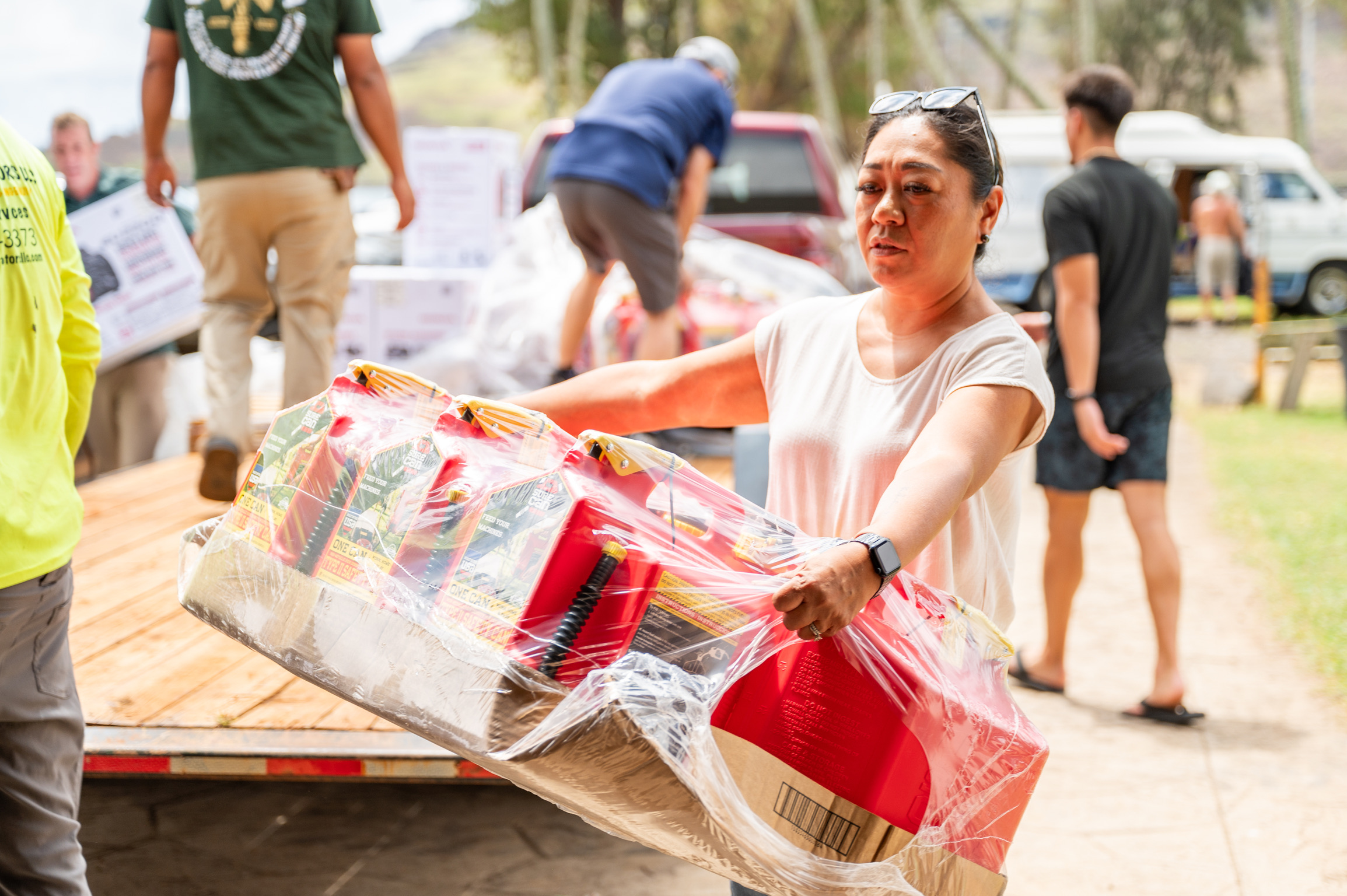 Volunteer carrying water containers