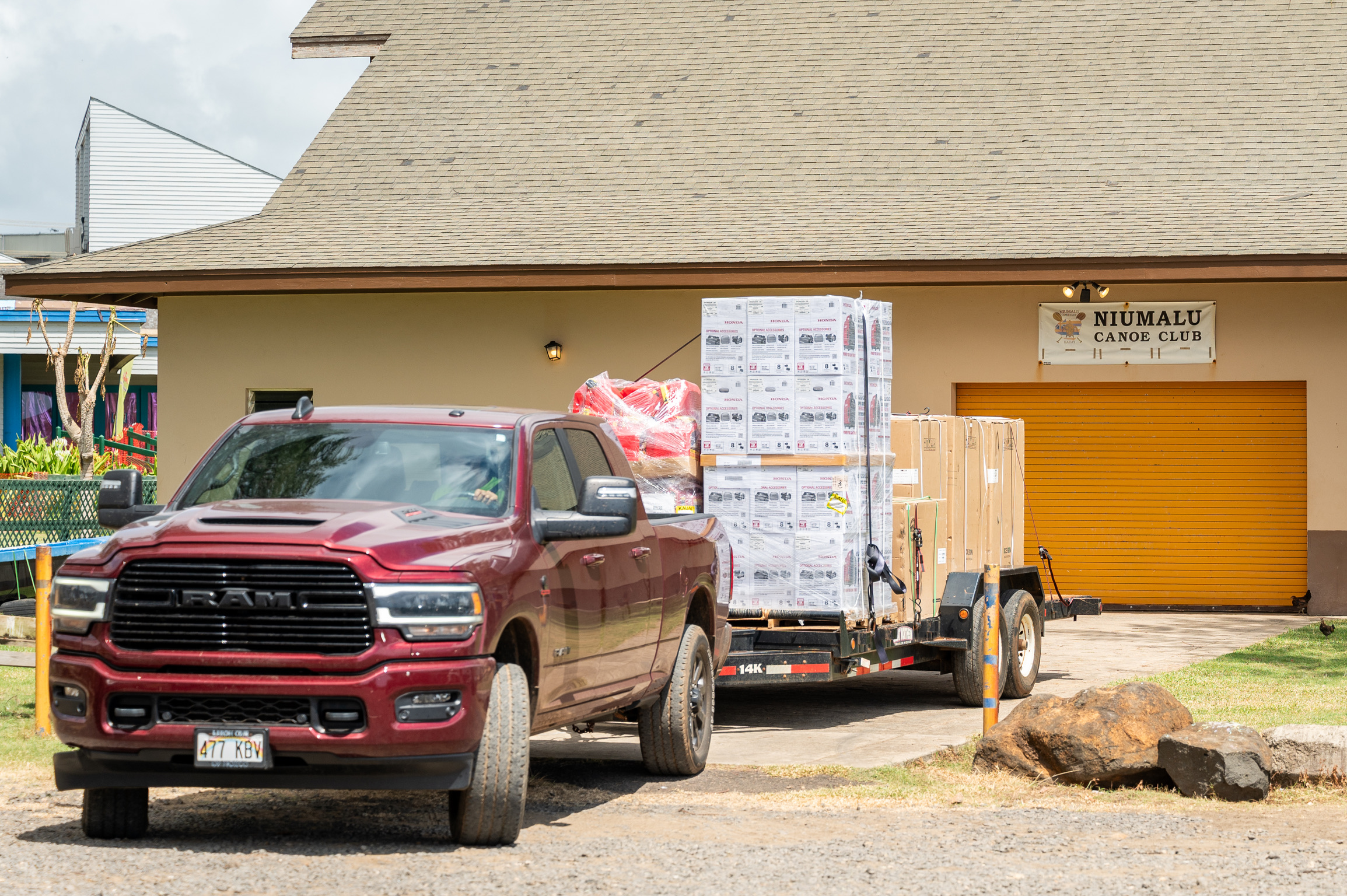 Truck and trailer delivering supplies at Niumalu Canoe Club
