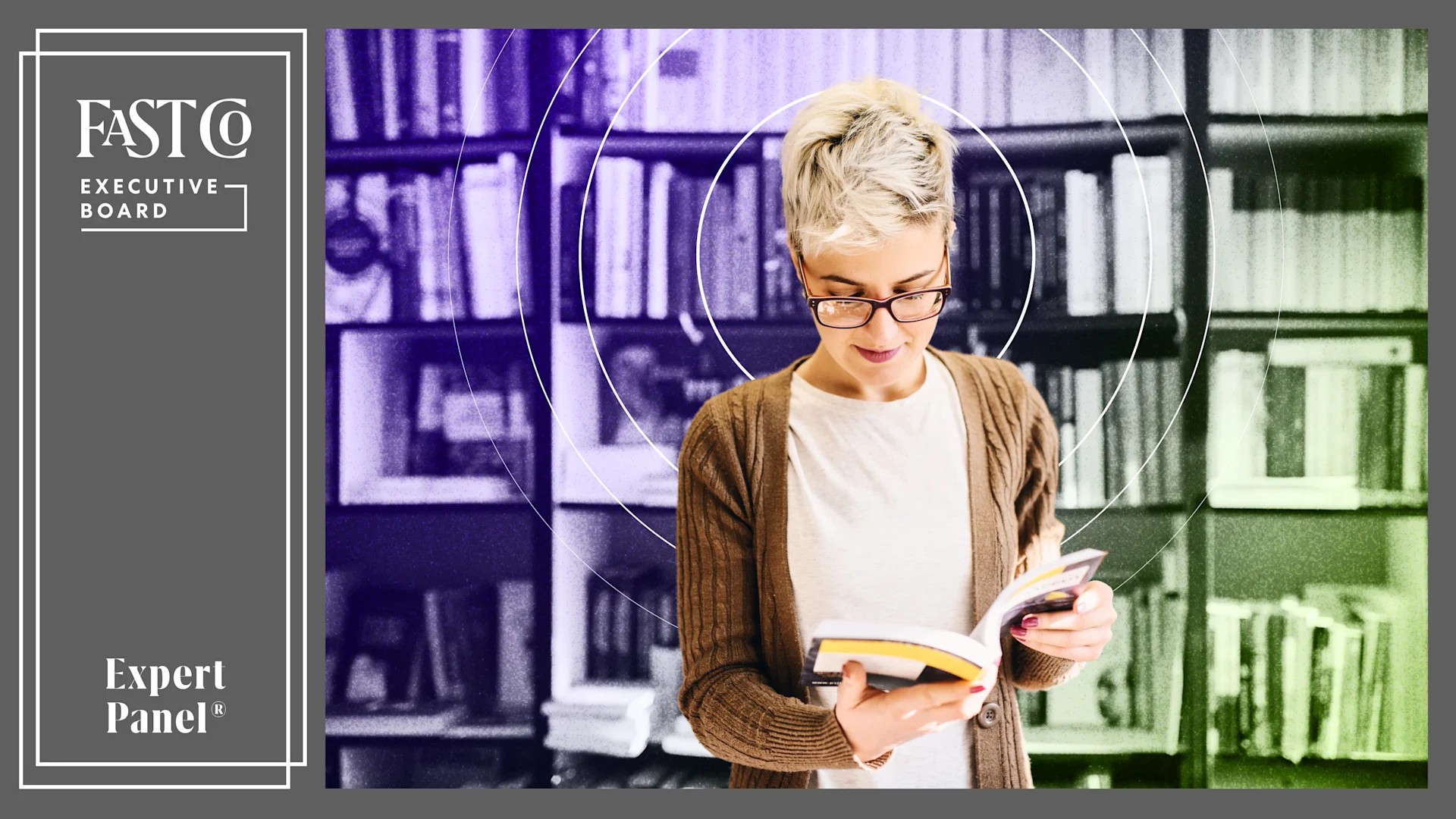 A person reading a business-focused self-help book