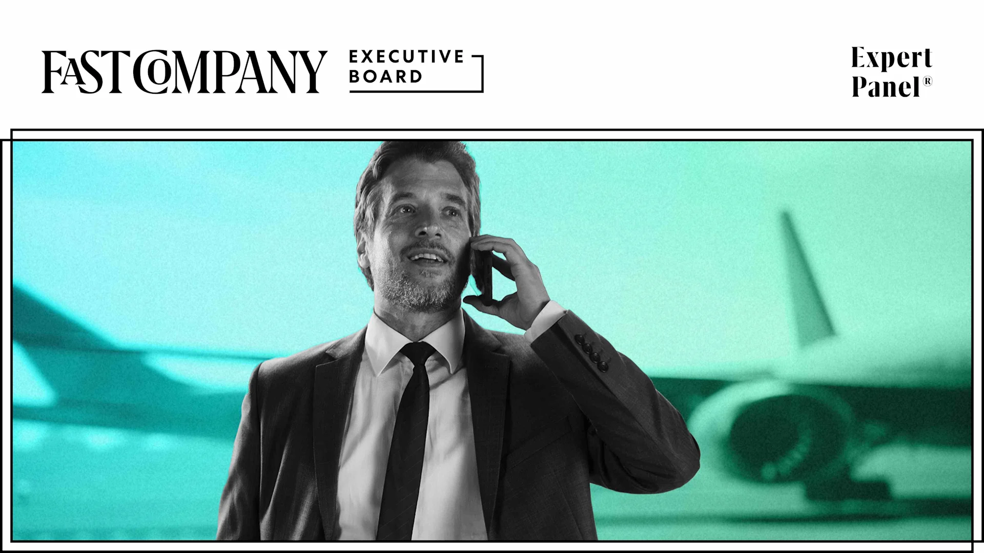 An executive talks on the phone during a conference