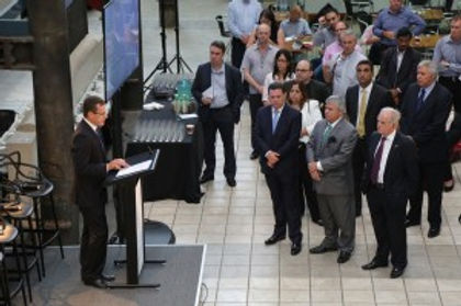 Photo of a speaker presenting in front of an audience at Innovation Central in Sydney