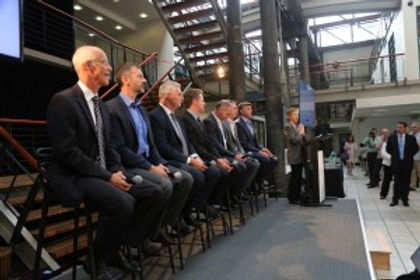 Photo of people sitting on high stools at Innovation Central in Sydney