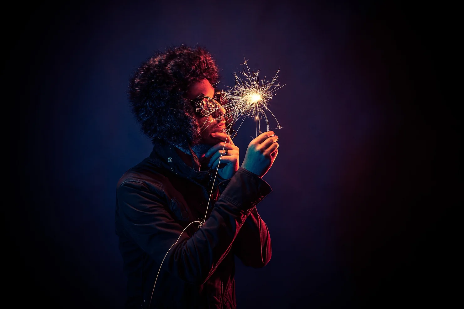 Photo of a man holding a popping cracker