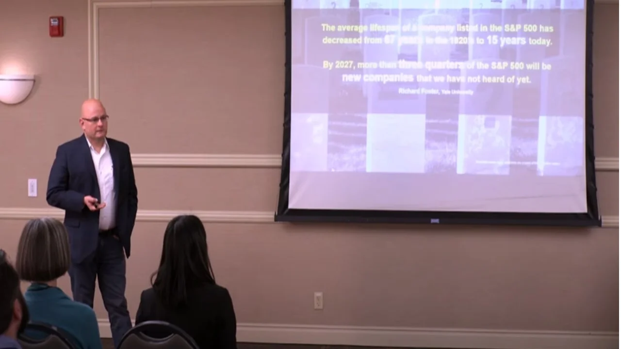 Photo of Alex Goryachev presenting in front of an audience