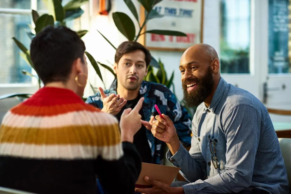 Photo of coworkers discussing