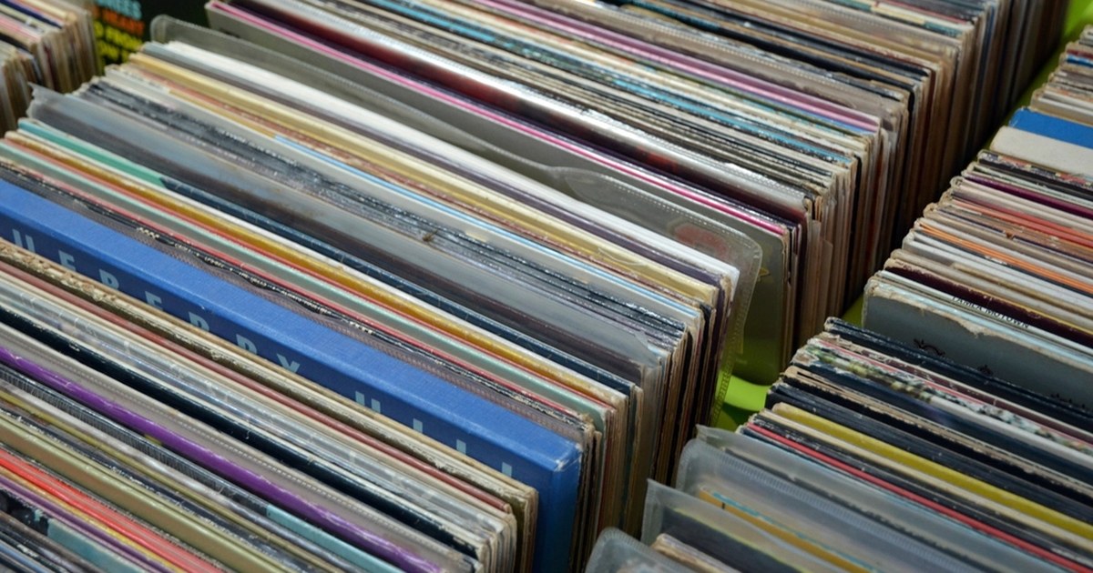 A wall of vinyl records in a music store, evoking the licensing reckoning at the center of the Suno/GEMA AI copyright ruling.