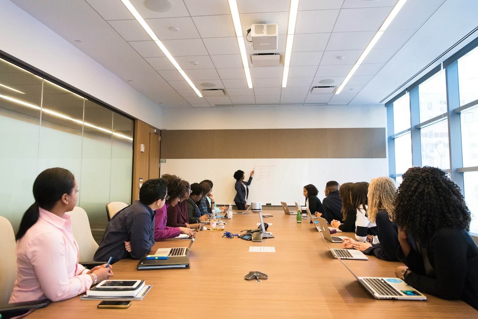 A CEO and board member in an executive meeting, representing the disconnect over who actually leads a company's AI strategy