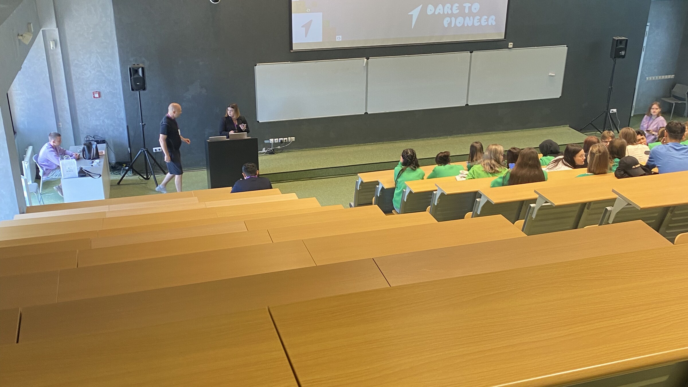 A university lecture hall with students using AI tools during class, representing AI's growing presence in higher education