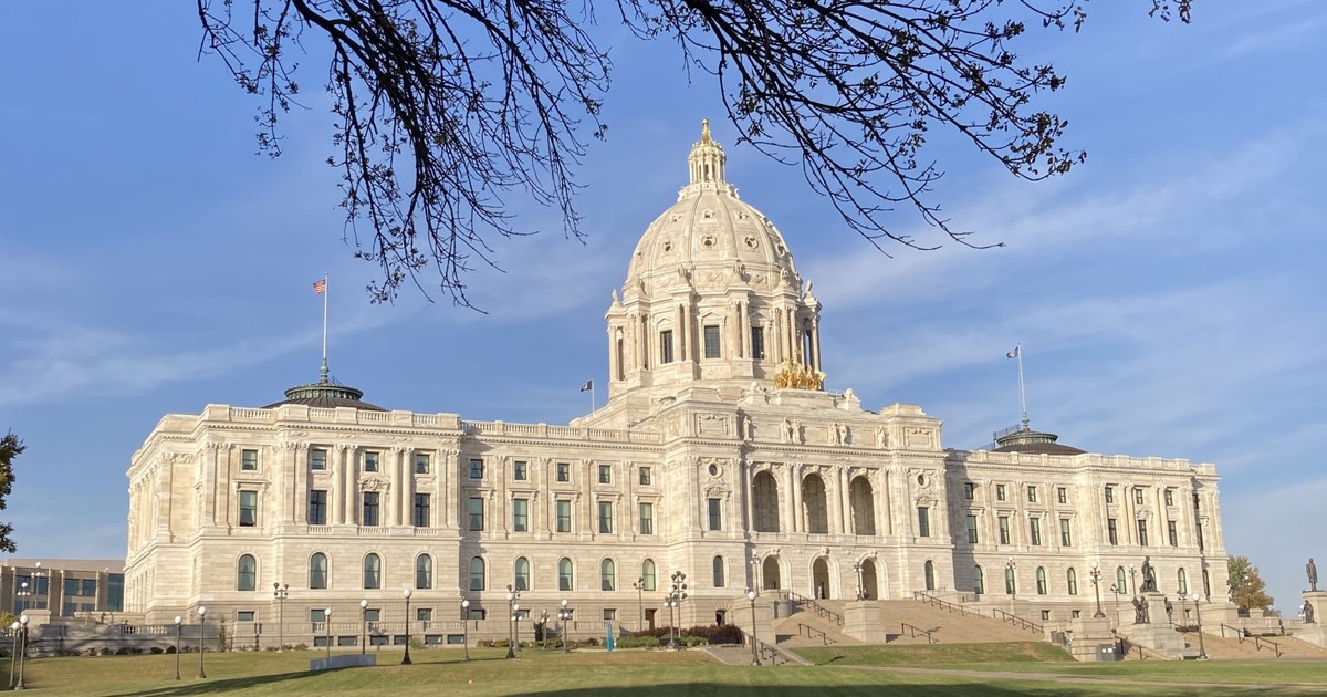 A grand state capitol building topped with a gilded dome under a clear blue sky, representing the kind of state government now writing new AI regulation like Connecticut's law.