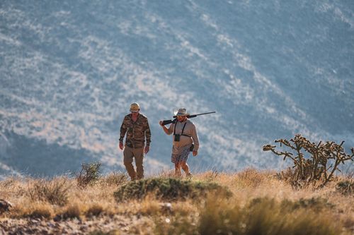 two corporate hunters on a hunting trip to close business deals and create fellowship and relationship