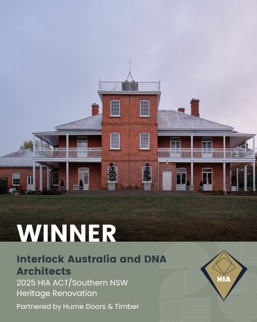 Large three-story historic country home called Highclere Farm with a central tower, white balcony railings, and a gray roof, awarded the 2025 HIA ACT/Southern NSW Heritage Renovation for Interlock Australia and DNA Architects.