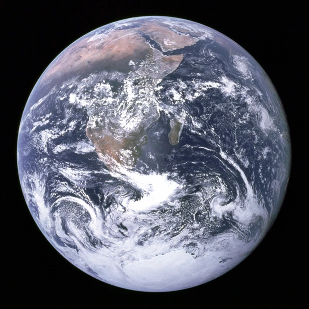 The famous Blue Marble photo taken by the Apollo 17 crew in 1972. The original photograph was taken with the South Pole facing the top, however, it is most widely distributed in the above upside down manner.
