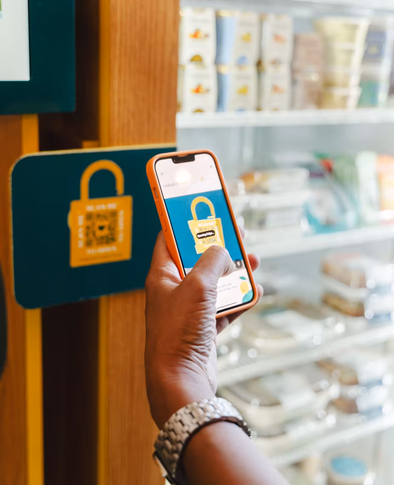 Employee scanning Fraiche smart fridge to access chef-made meals
