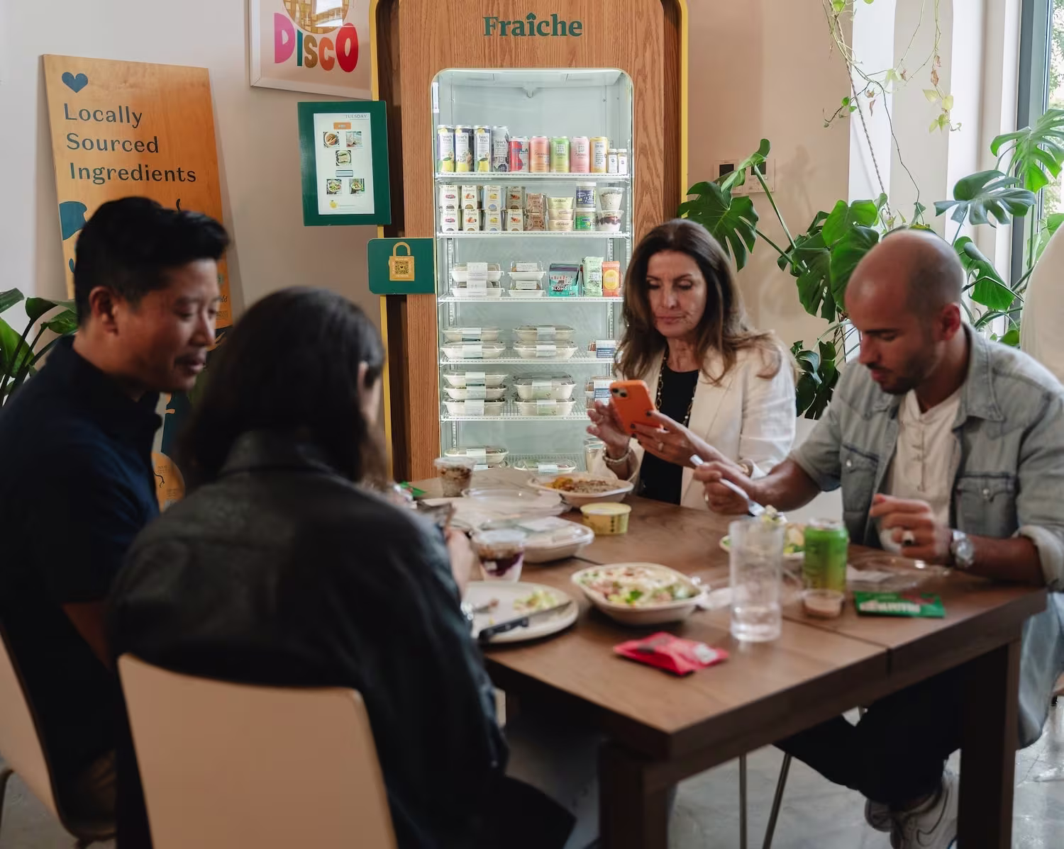 Office team enjoying healthy meals from fresh food vending machine