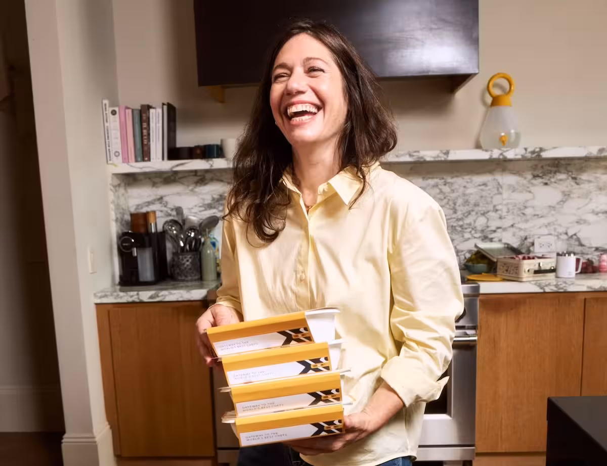 girl holding prepared meal trays