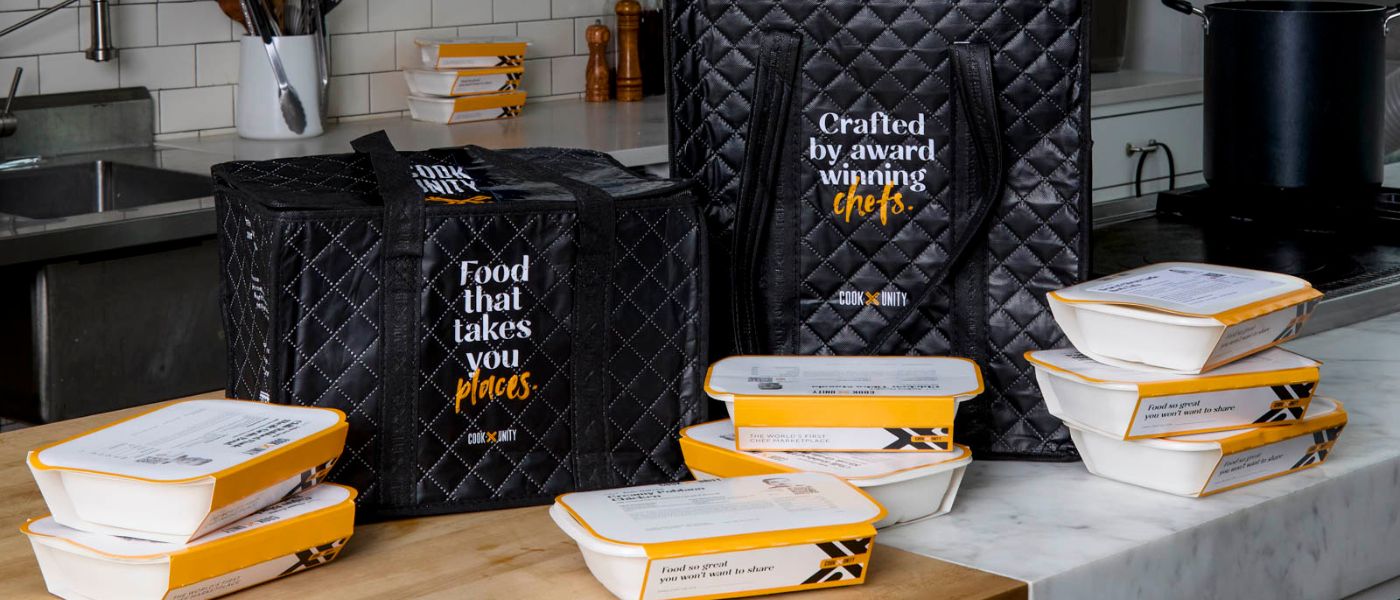 CookUnity meals being distributed in individual packaging as part of a behavioral health meal program