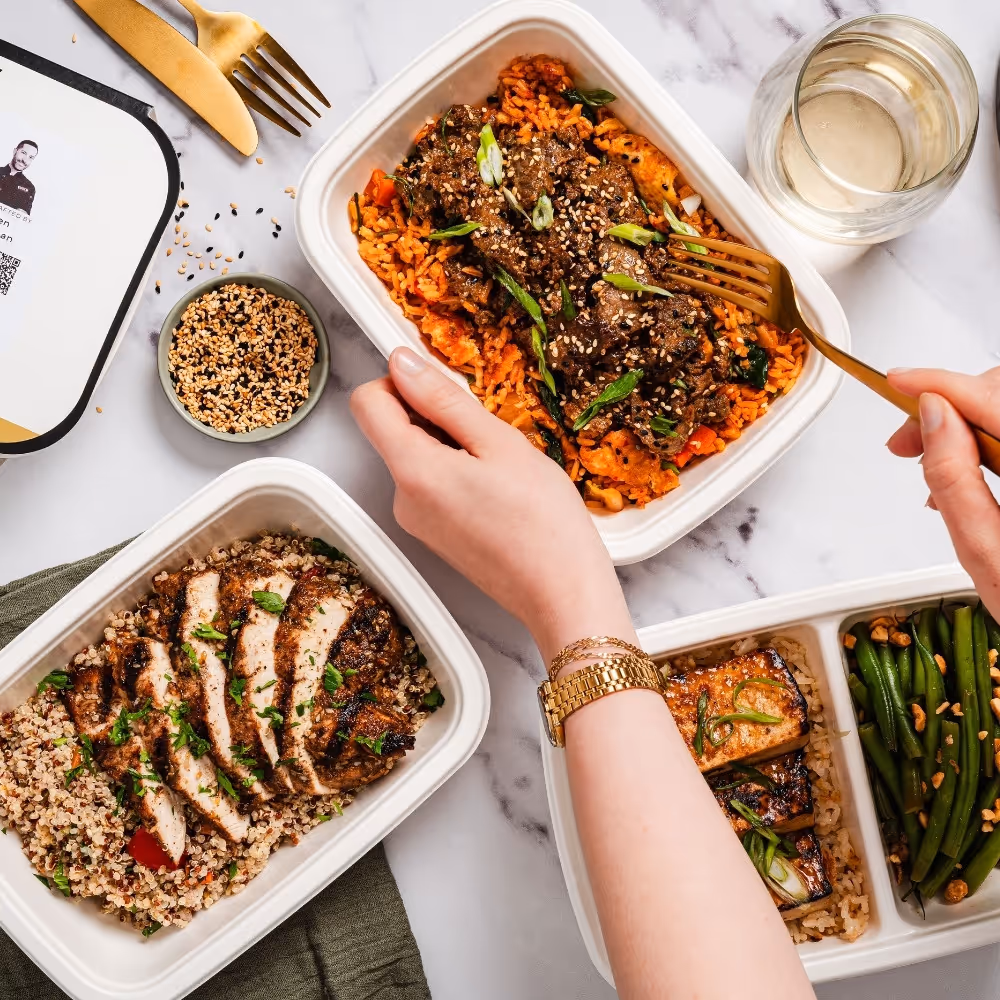 Residents eating cookunity meals from a smart fridge in an apartment building