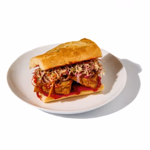 Gochujang tofu bánh mì offered as a plant-based corporate lunch option