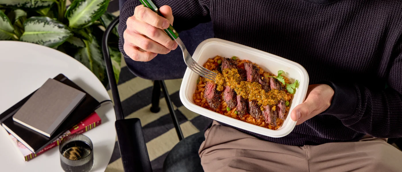 Person enjoying a chef-prepared CookUnity meal