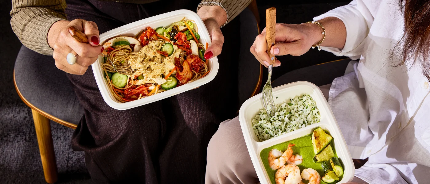 People enjoying CookUnity meals together