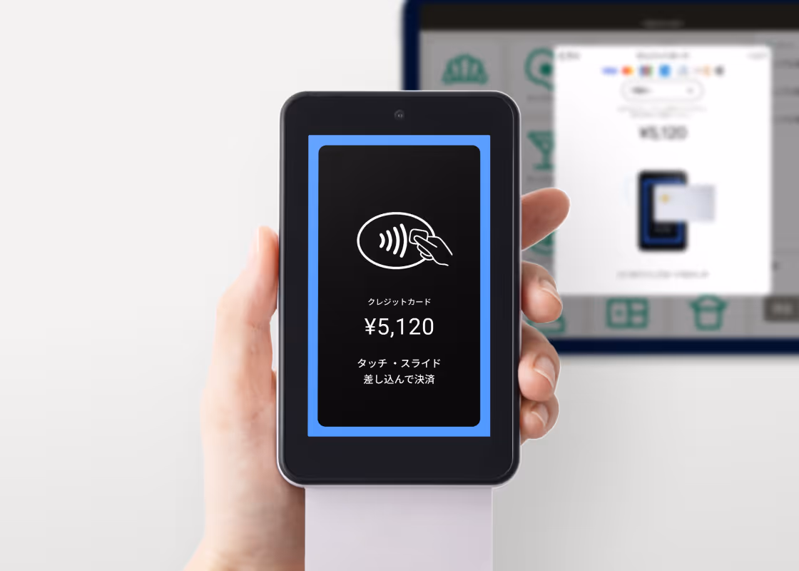 決済端末でクレジットカードを読み取っているイメージ写真