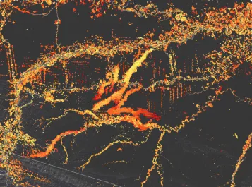 Map highlighting a network of rivers and tributaries in bright orange and yellow on a dark background.
