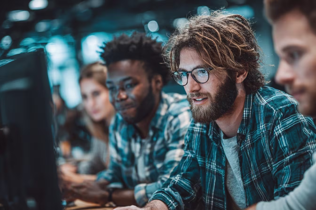 Diverse team working on IT compliance frameworks