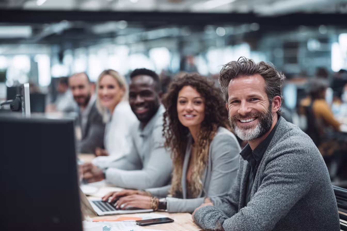 Diverse team studying cyber insurance guide