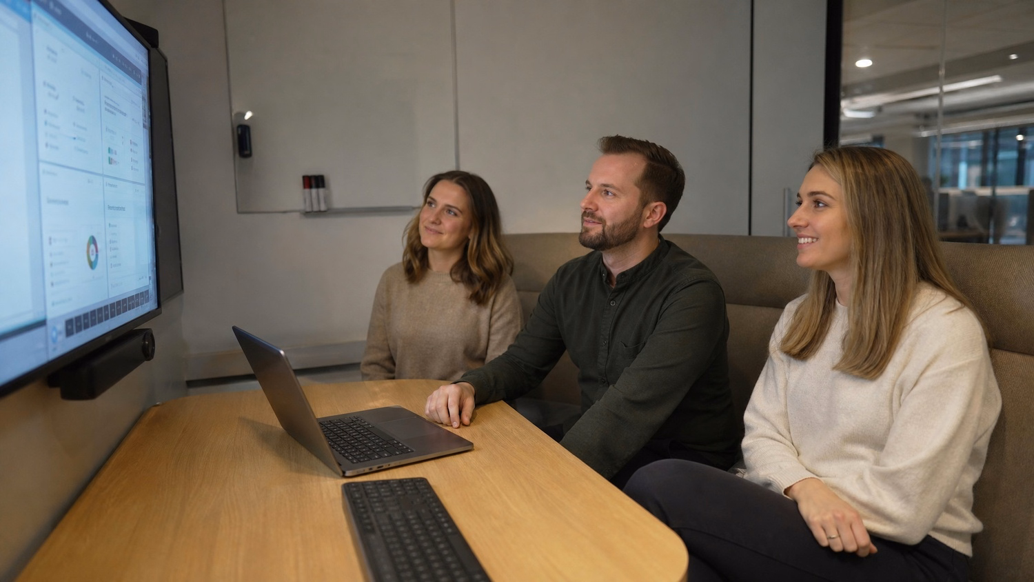 Team reviewing phishing tactics on screen in huddle room 60 chars