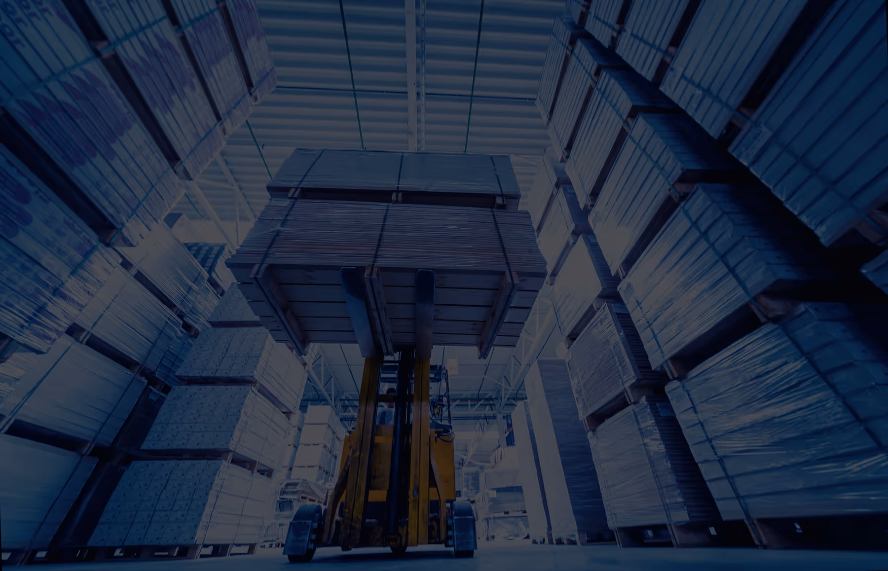 Warehouse stacked with wrapped and packaged pallets