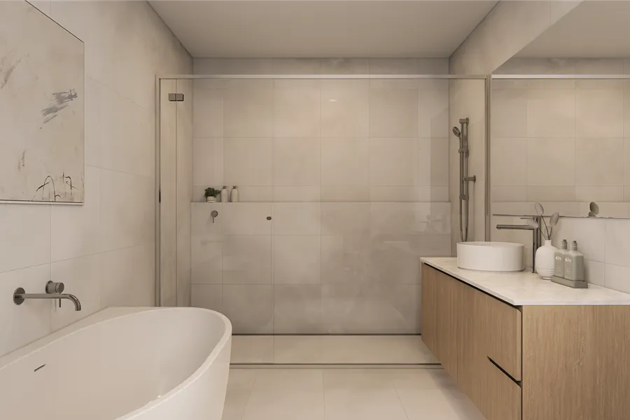 Modern two-story residential buildings with white and brown facades, surrounded by small trees and greenery along a street.