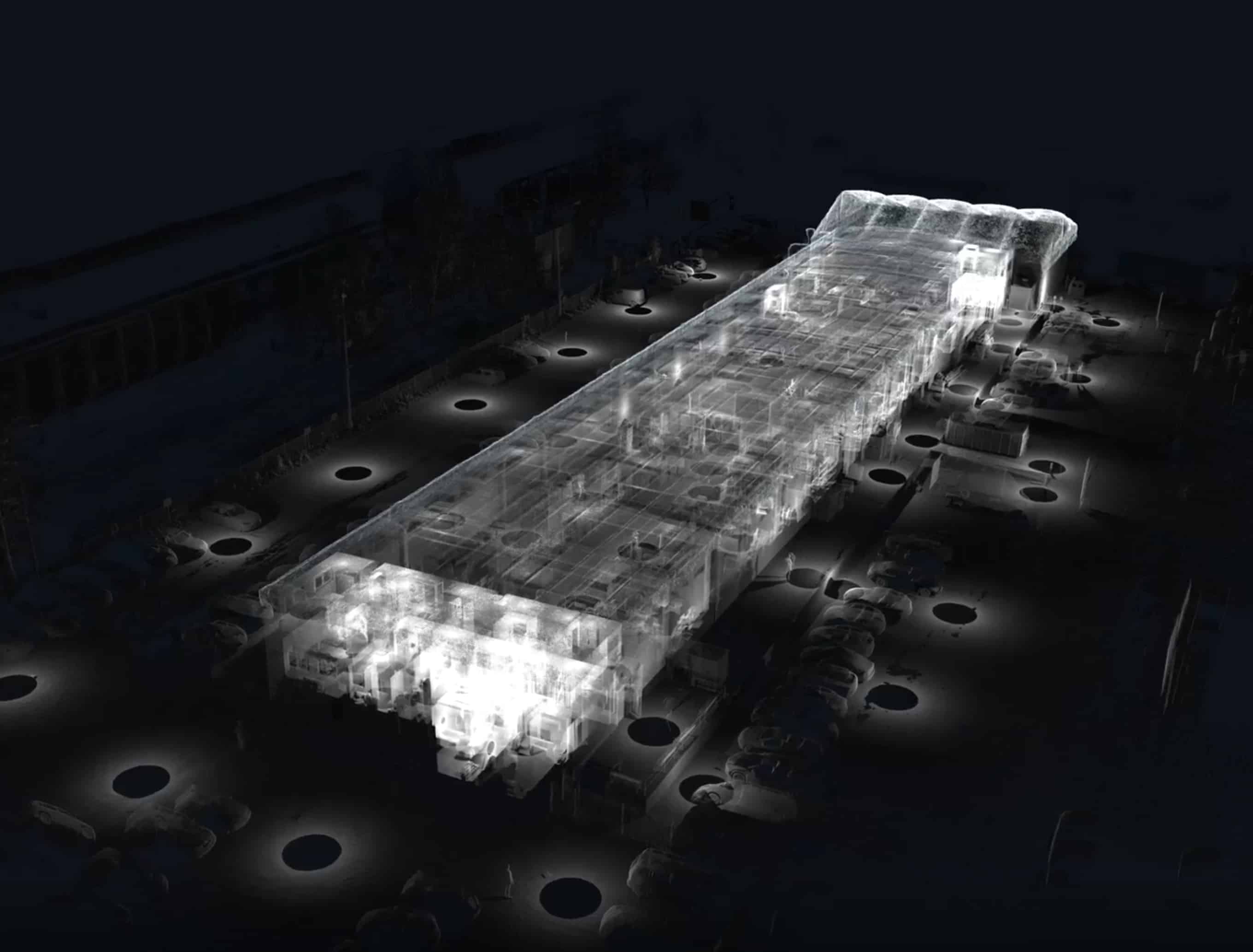 Nighttime point cloud visualization of a long warehouse building, rendered in transparent white over a dark base.