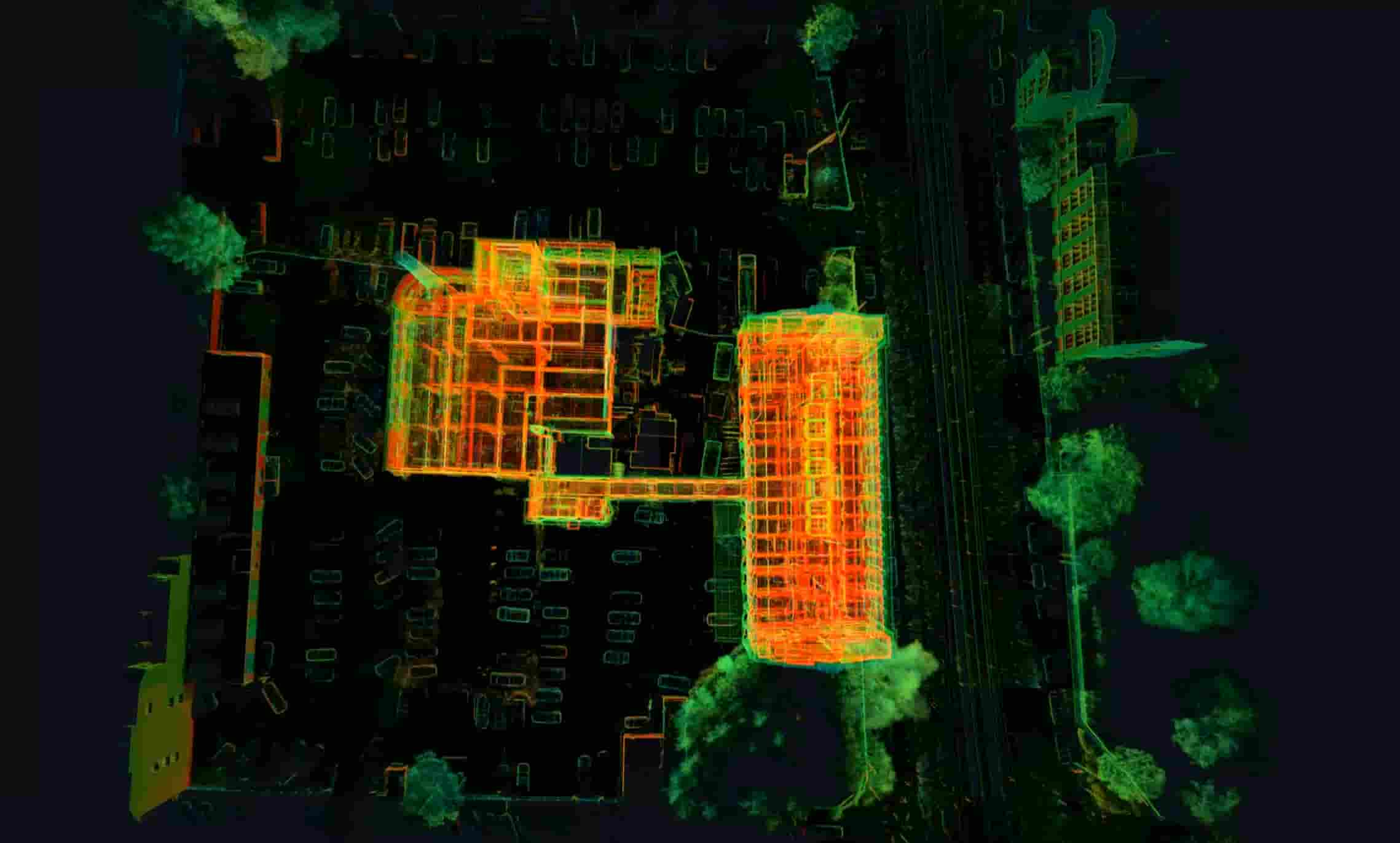 Top-down laser scan showing building floor plans and surrounding parking lot, enhanced with thermal visualization.