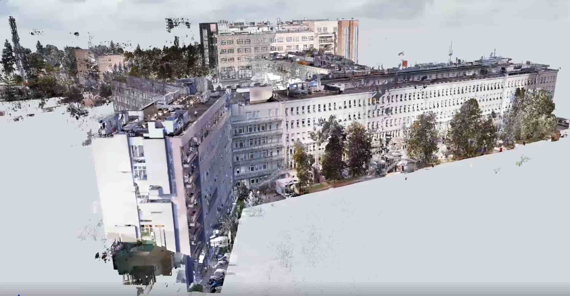 High-resolution 3D point cloud scan of a large hospital complex surrounded by trees and urban infrastructure.