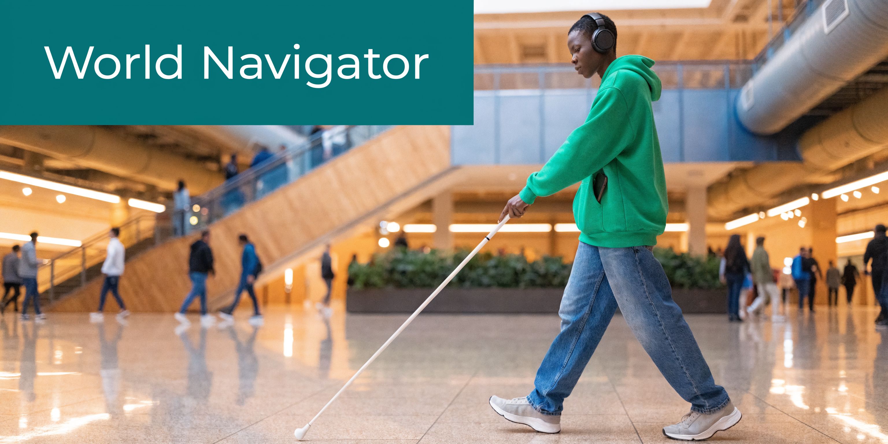 A visually impaired person walks through a modern public building using a white cane and wearing headphones.