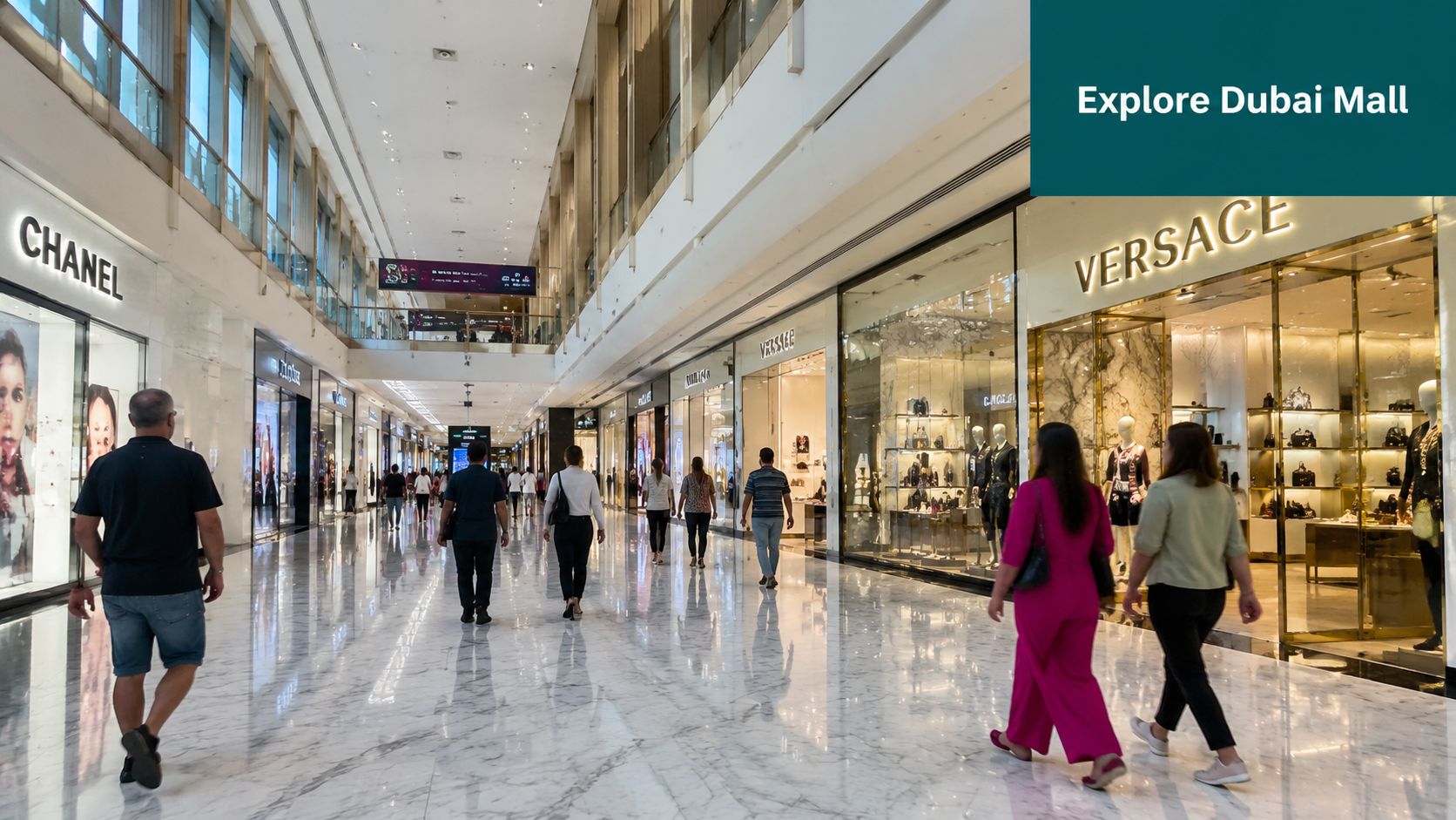 A wide, bright hallway in the Dubai Mall with luxury storefronts and people walking on marble floors.
