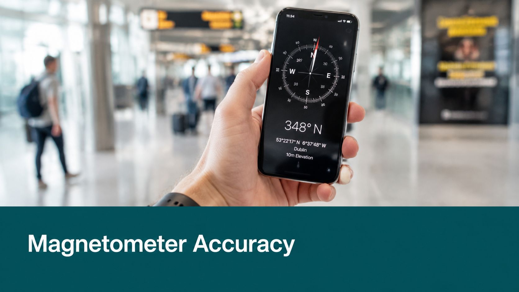 A close-up shot of a smartphone held in a hand showing a compass app inside an airport terminal.