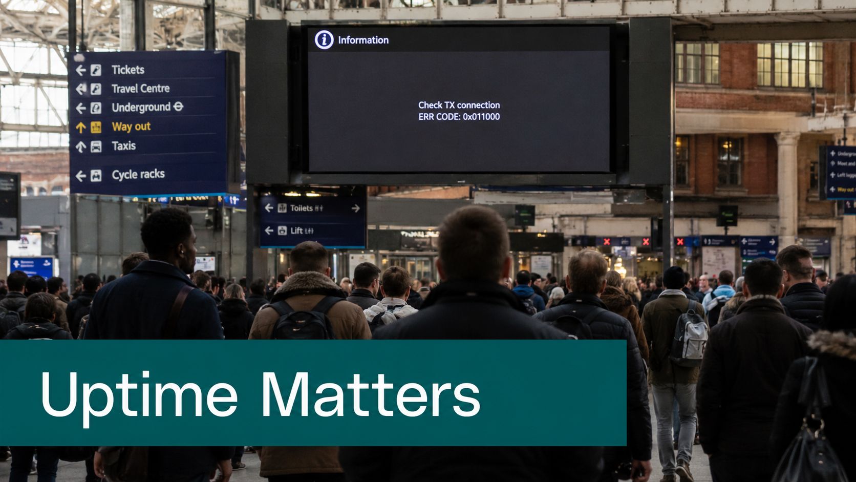 A crowded train station concourse featuring a large digital display showing a transmission connection error message.