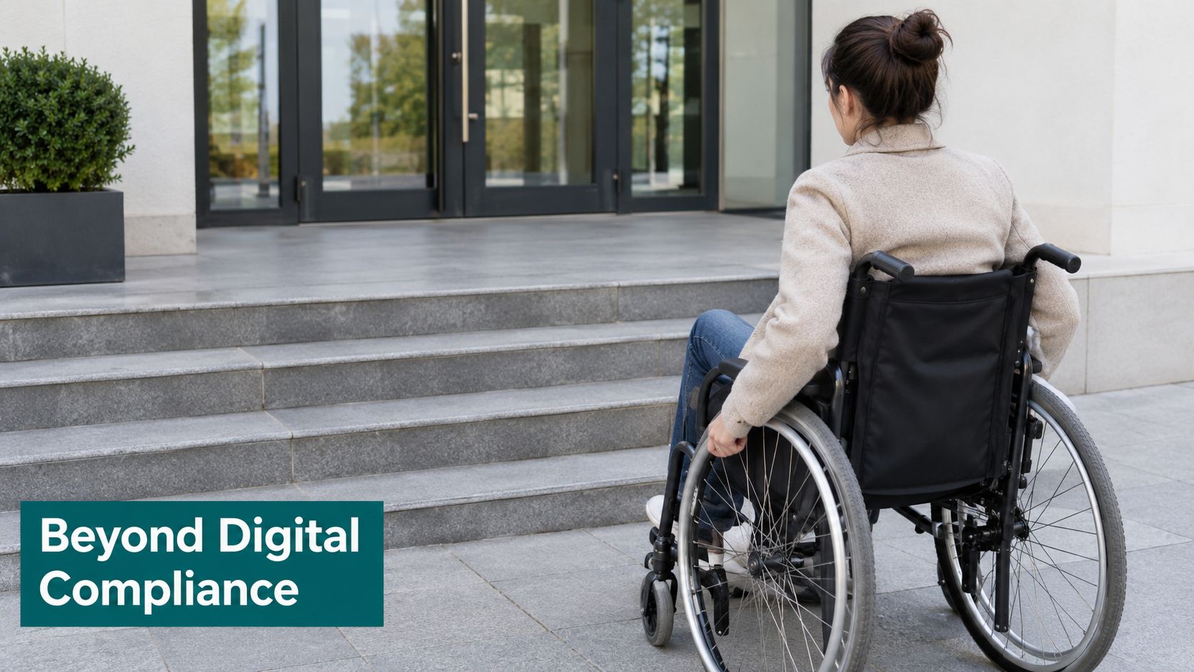A woman in a wheelchair facing a set of stairs leading to a building entrance.