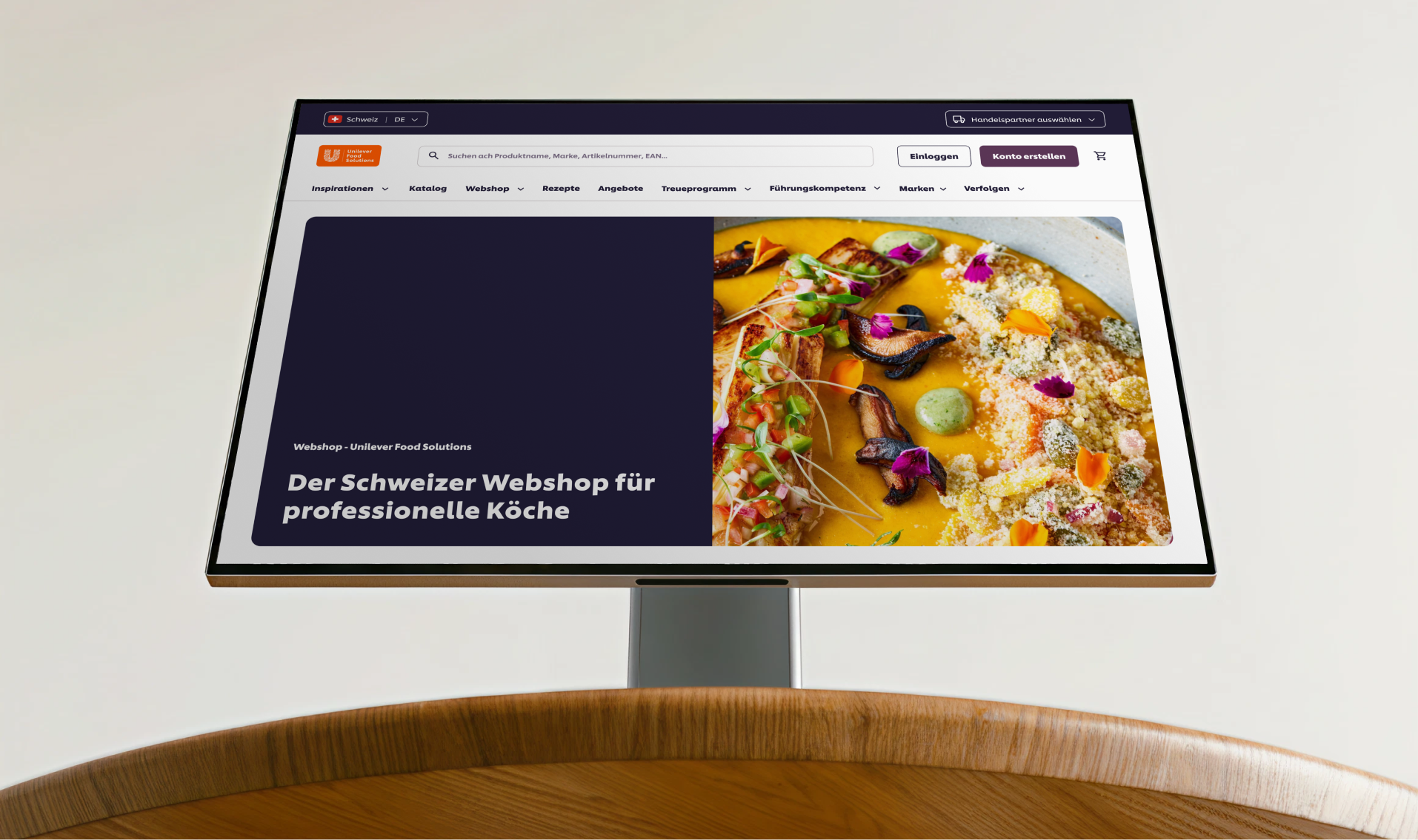 Open laptop showing Unilever Food solutions online store created on Shopify with product recommendations for food items and prices.