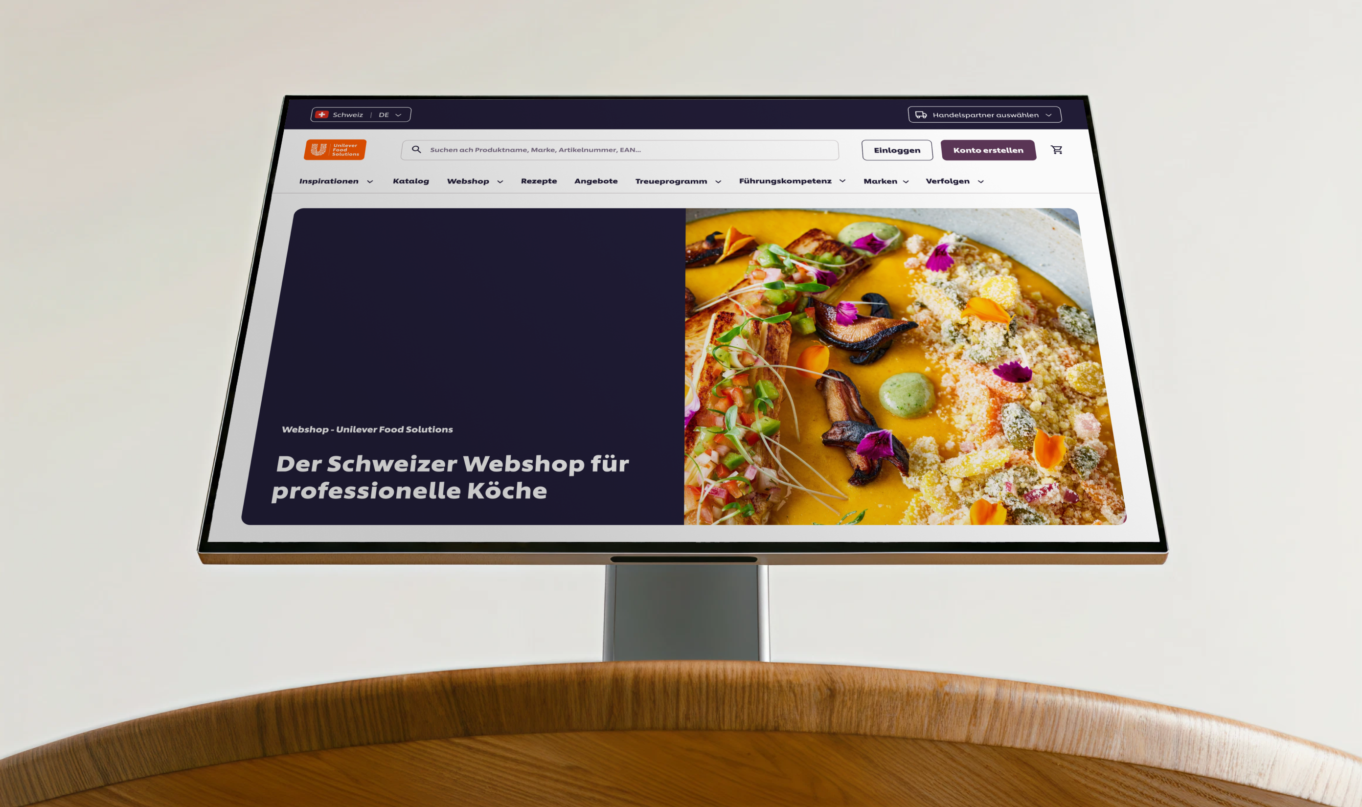 Open laptop showing Unilever Food solutions online store created on Shopify with product recommendations for food items and prices.