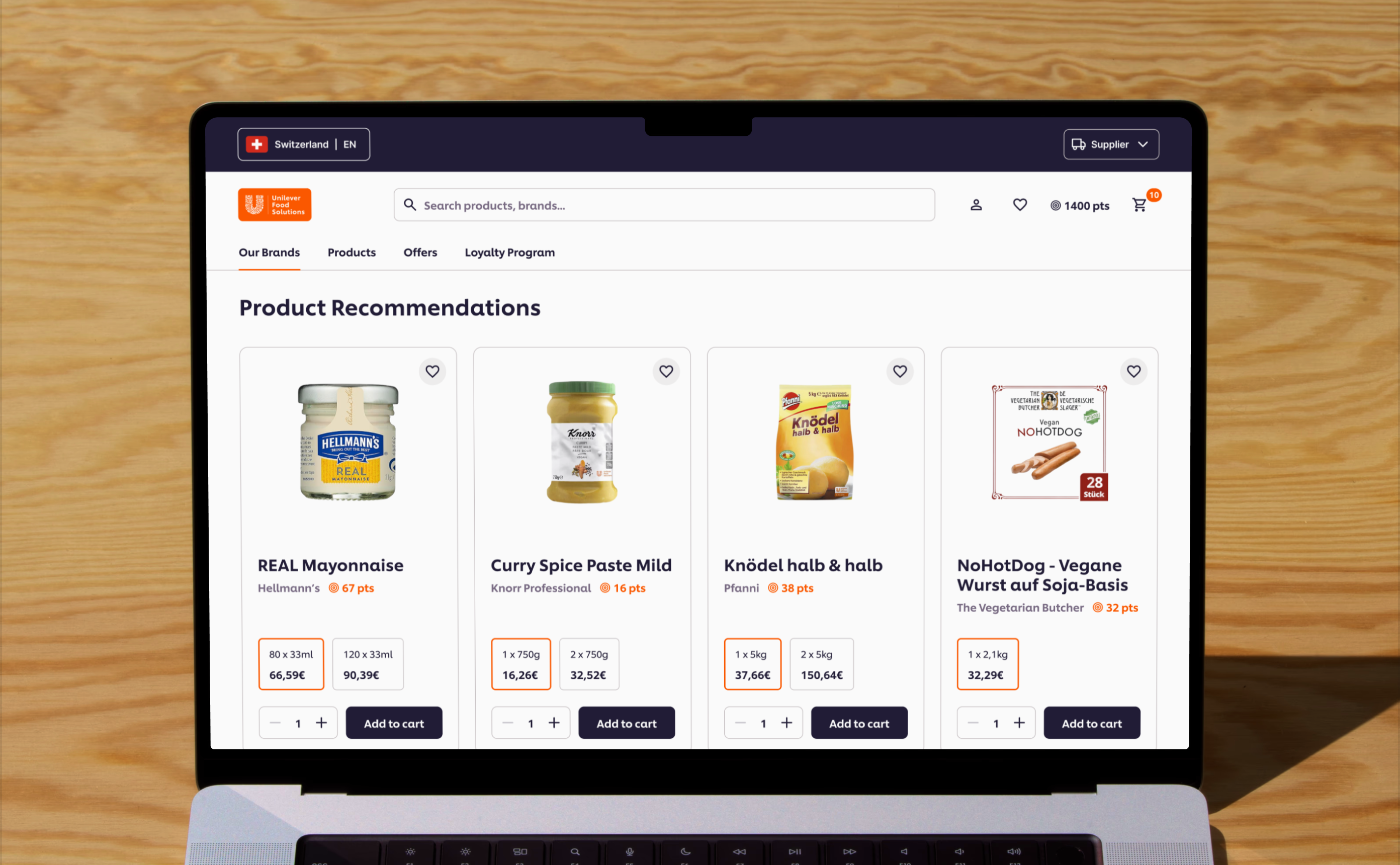 Laptop screen showing Unilever Food Solutions Shopify webshop product page with product cards.