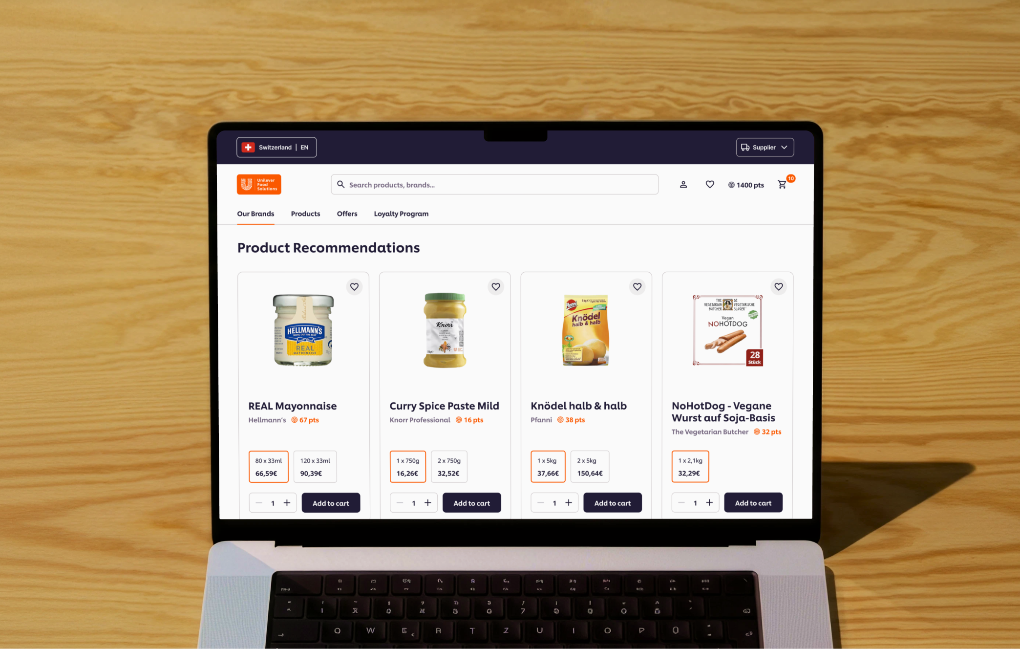 Laptop screen showing Unilever Food Solutions Shopify webshop product page with product cards.