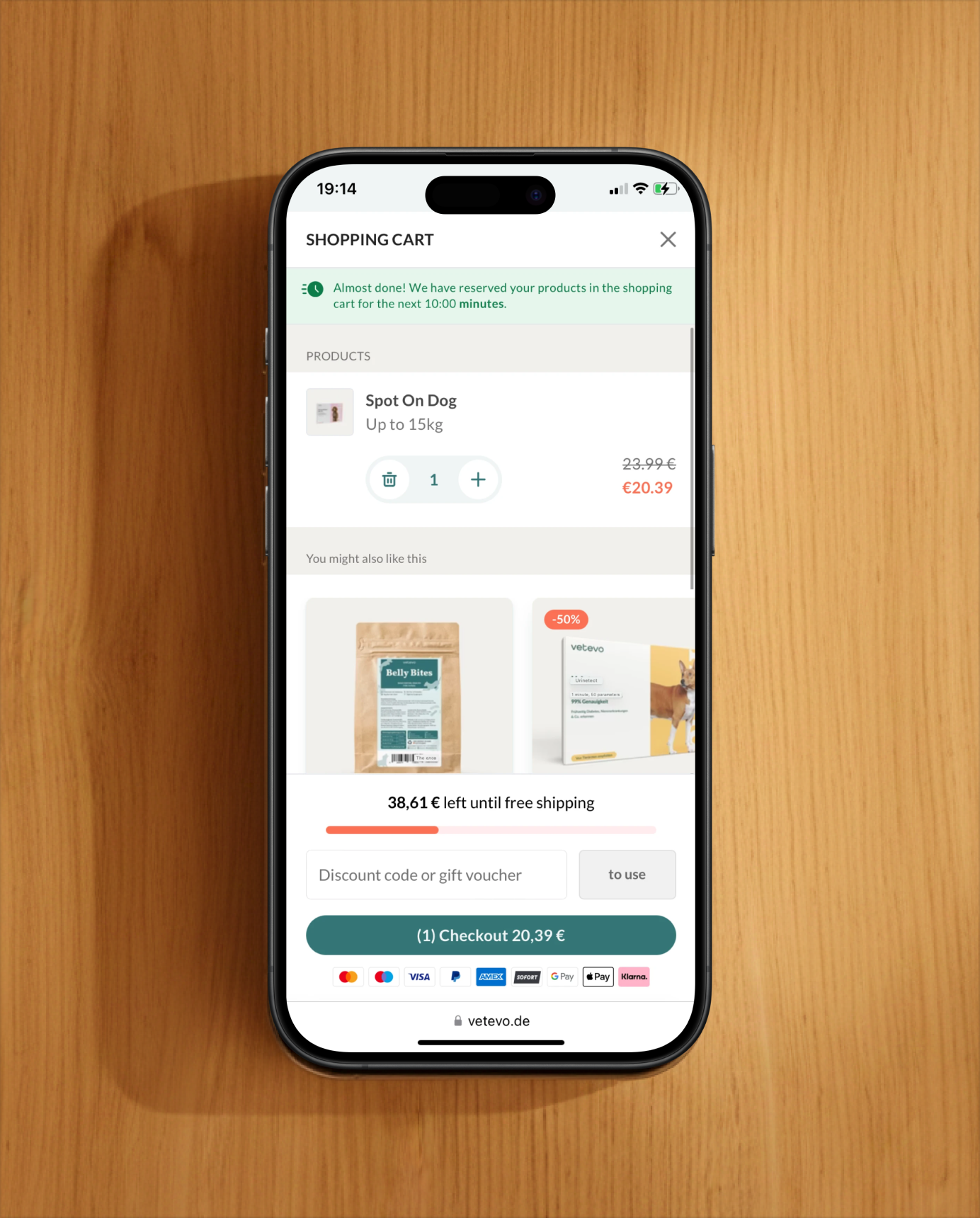 Desktop checkout form displayed next to customer pet photos and product reviews highlighting the purchase journey and social proof.