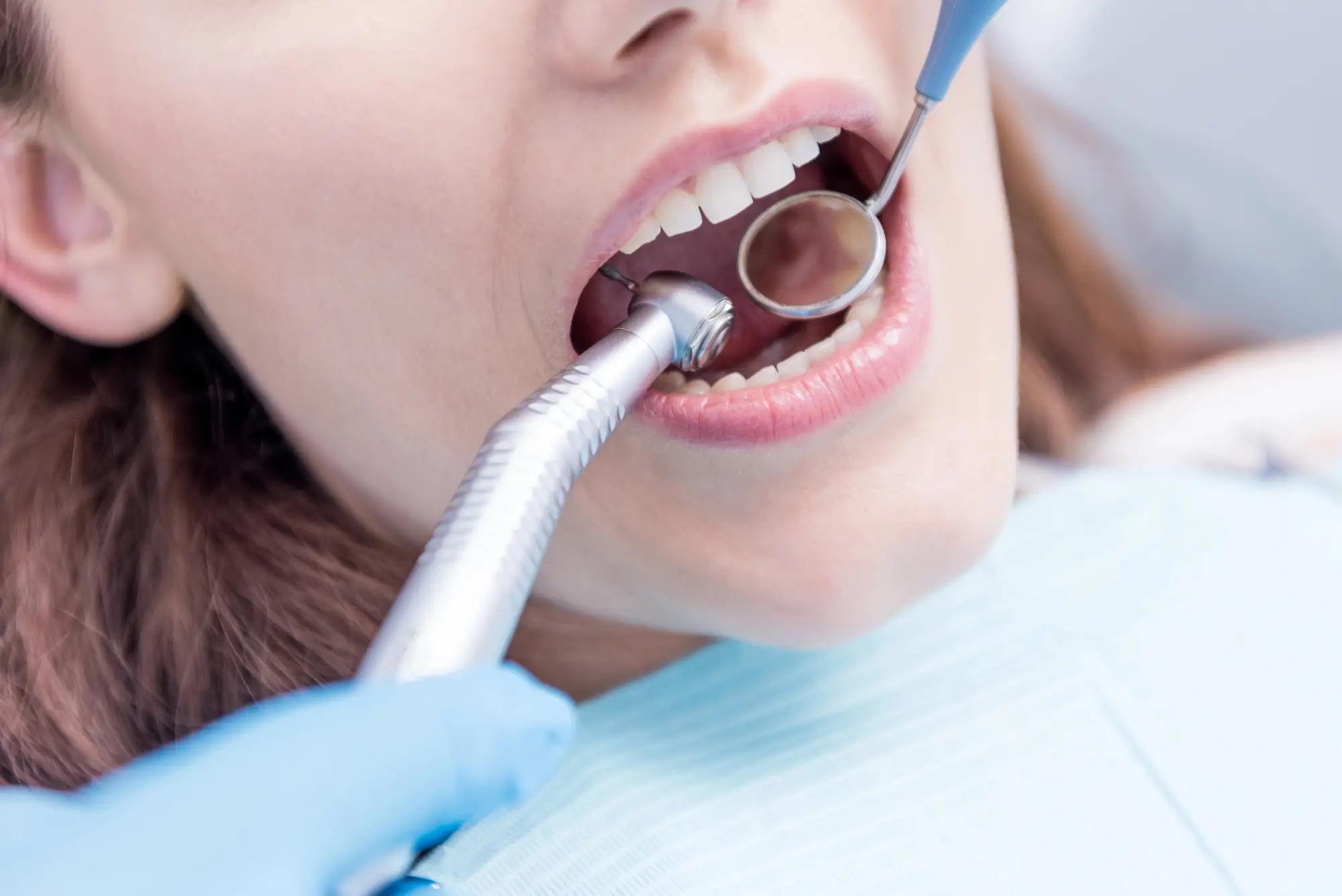 Dentist curing teeth at Montgomery Family & Cosmetic Dentistry.