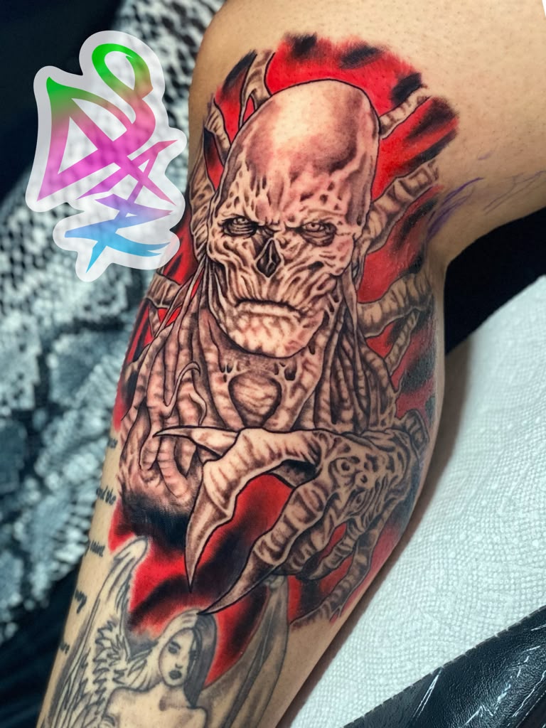 Gothic horror skull tattoo in black and grey with red background by Jasmyn SweetJaz
